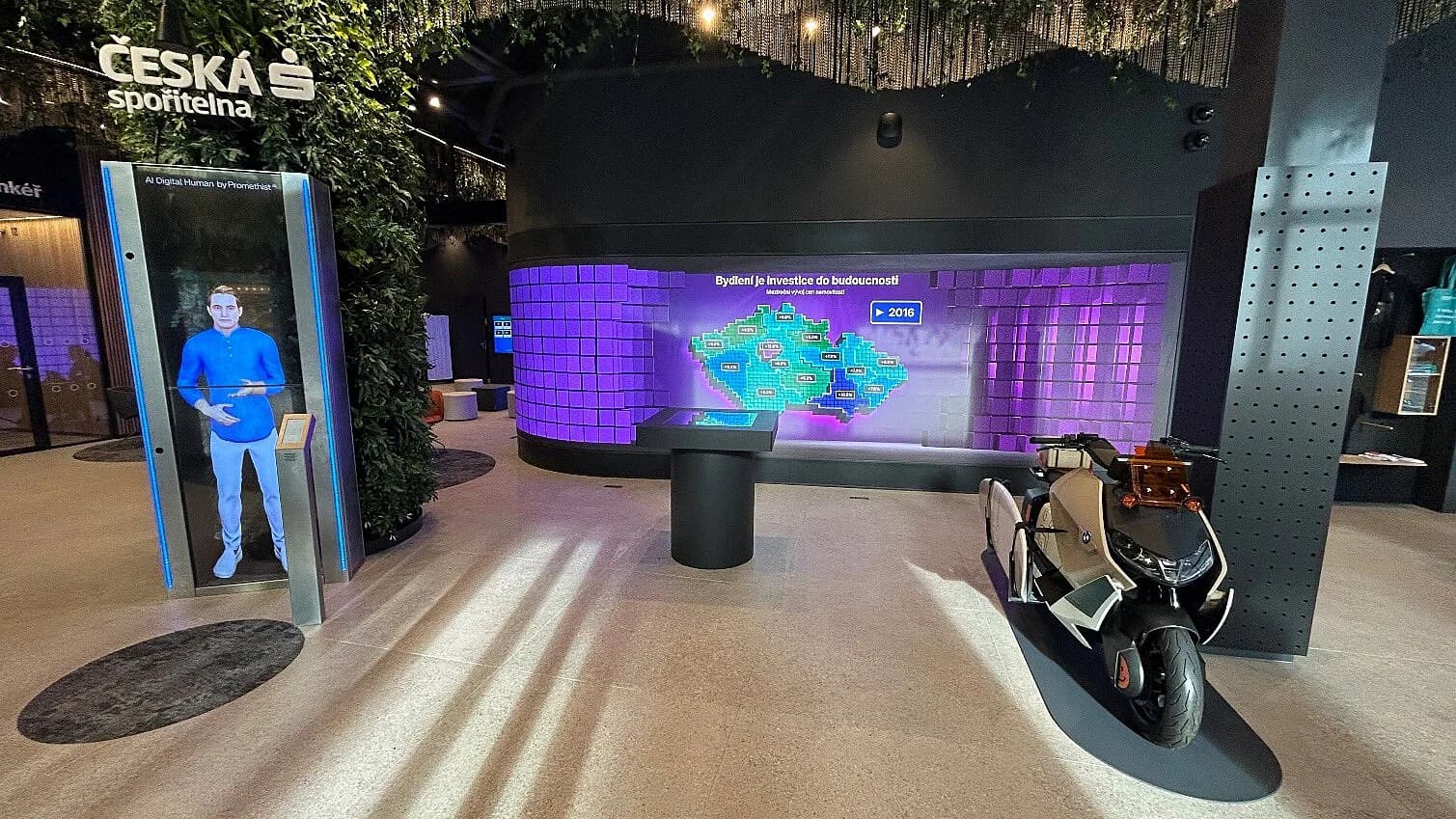 Future Lab interior, kiosk, curved LED wall displaying Czech real-estate data, and open space
