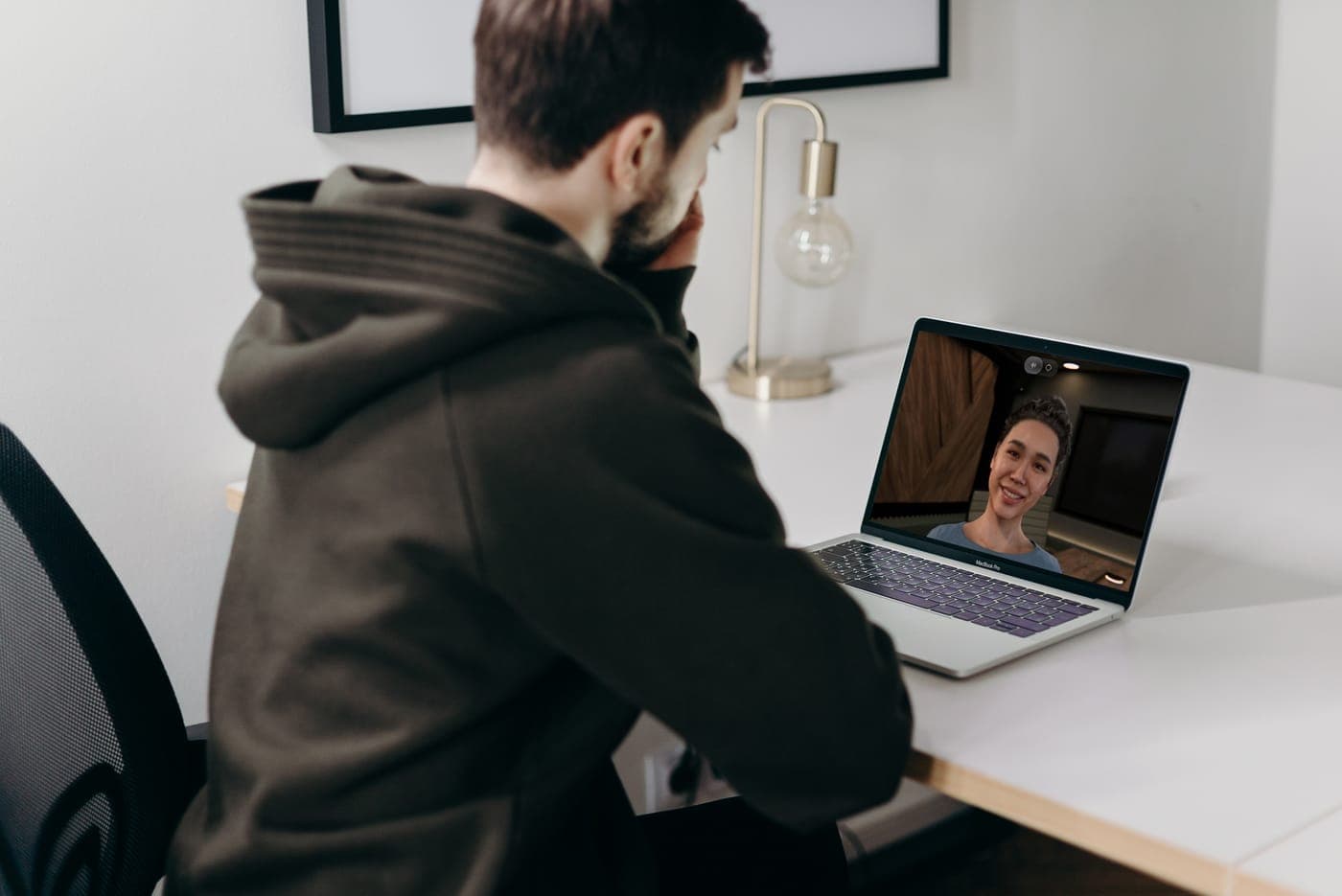 A banker rehearsing a client conversation out loud with a simulated client